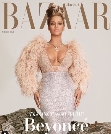 Beyonce on the cover of Harper's Bazaar in a pale feathered dress
