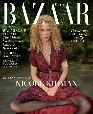 Nicole Kidman sits on the grass in a red dress on the cover of Harper's Bazaar