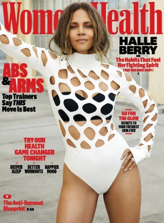 halle berry in a cutout white bathing suit on the cover of womens health