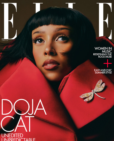 doja cat wears a red coat on the cover of Elle
